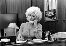 Country singer Dolly Parton acts in a scene from the movie "9 to 5" which was released on December 19, 1980. (Photo by Michael Ochs Archives/Getty Images) 