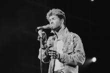 English singer and songwriter George Michael performing on stage during the Japanese/Australasian leg of his Faith World Tour, February-March 1988. (Photo by Michael Putland/Getty Images)